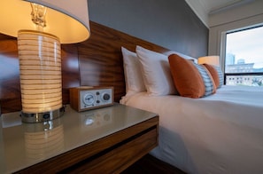 Elegant bedside amenities in our Junior Suite, complemented by modern decor and ambient lighting for a soothing ambiance.