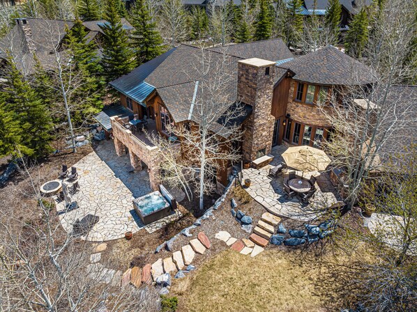 Multiple outdoor spaces to gather and relax - private hot tub