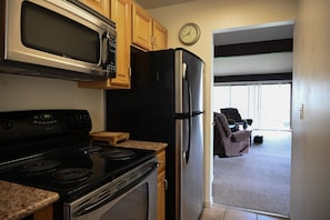 Galley-style kitchen stocked with all the essentials