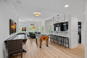 Lower Level Game area with foosball and shuffleboard.