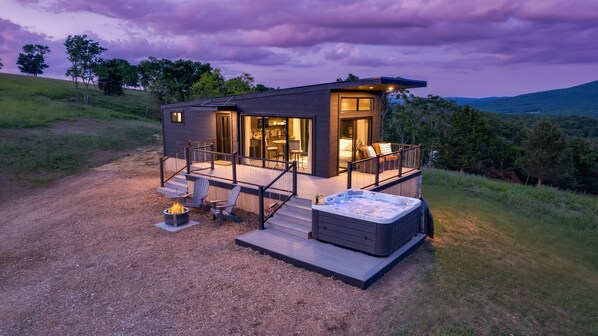 From a hot tub, to the fire pit, to the gorgeous outdoor furniture sets... this home in paradise has it all!