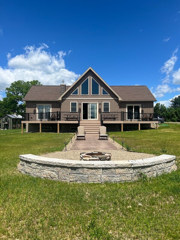 rear of house with firepit