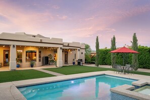  Vibrant poolside living with a stunning sunset backdrop