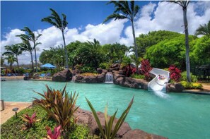 Relax at our resort-style pool, complete with a fun slide and cozy jacuzzi. Our pool even includes a sandy-bottom, shallow 3ft, keiki area. Need towels? Find them at the Clubhouse check-in.