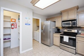 Open concept kitchen with large pantry
