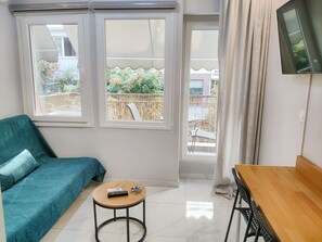 Living area, desk and balcony