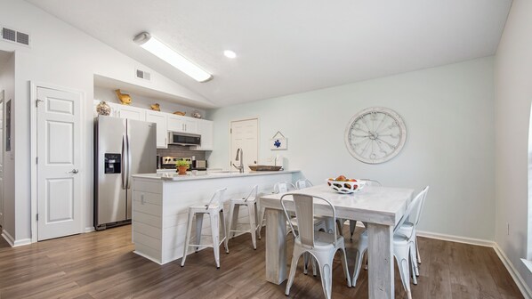 The dining and kitchen space seats 10 in all. 