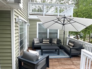 Large outdoor deck with sun umbrella & new Weber gas grill