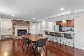 Dining area with electric fireplace and bar seating