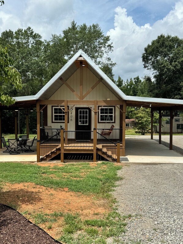 Custom built & brand new! Carport is well lit w/electrical outlets for charging 