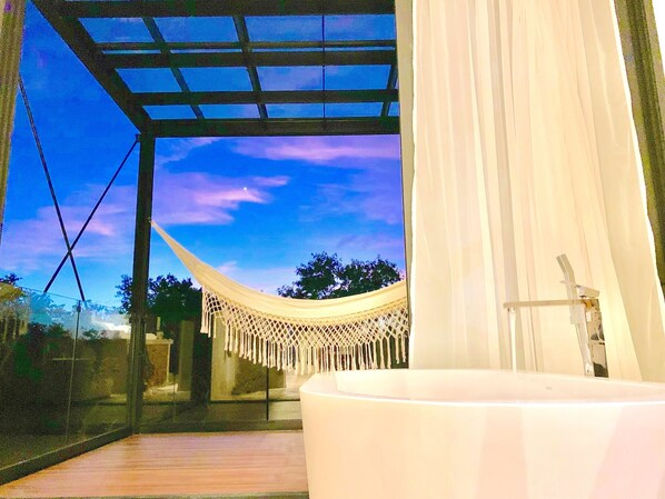 Master bathroom with amazing jungle views. Perfect for a sunset bubble bath.
