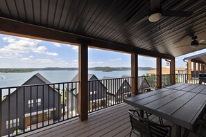 Main Level: Deck w/ dining table for 16, Weber bbq grill, & lake views