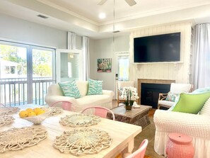 Two screened doors beckon you to embrace the tranquil marshside breezes. 