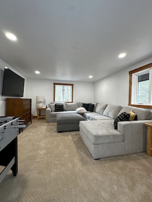 Upstairs Living Room with Plenty of Seating and Smart TV