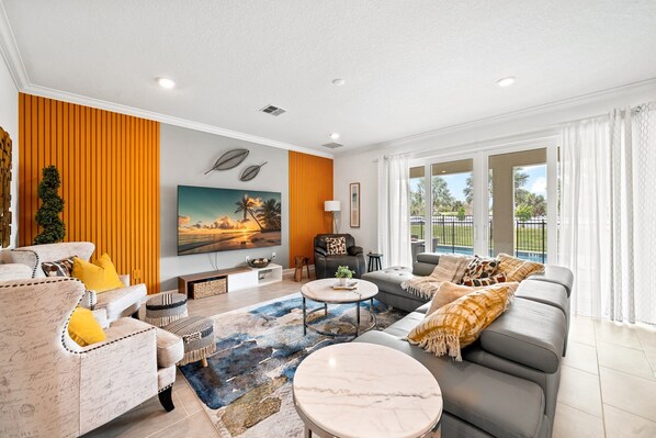 Bright and inviting space with cozy seating, modern decor, and an open, airy feel!