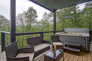 1 of many deck areas at this beautiful home. This area is located off from the dining room!