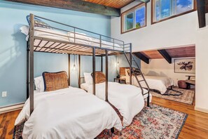 Bunk bed with (2) twin beds on bottom & (1) full bed on top & extra full bed