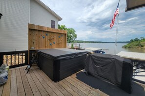 The deck will be your landing spot!  Hot tub, Blackstone, Traeger, all with lakeviews!