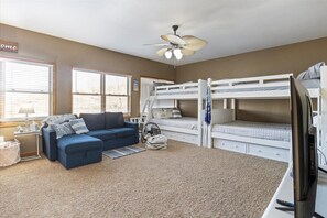 The upper level bunk area is a favorite spot among kids.  They can get away and take in their favorite shows while lounging comfortably on their beds or couch.