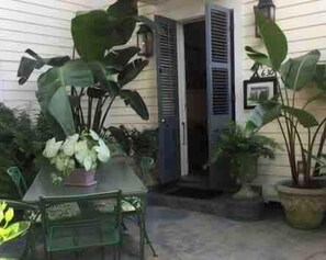 The courtyard entrance to the fully stocked apartment. Lovely quiet neighborhood with easy walking to the French Quarter and Frenchmen Street.  Only steps from local restaurants and bars. Patio and swimming pool quiet and hidden from the street.