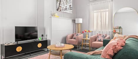 Cosy lounge room with oversized lounge, armchairs & stools for extra seating.