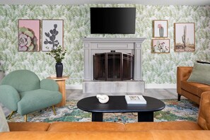 Cozy up by the indoor fireplace and enjoy your smart TV in style