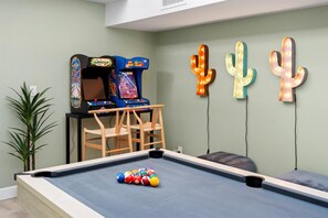 Awesome game room with pool table, arcade games, ping pong, and basketball!