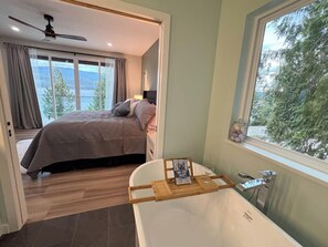 Main floor ensuite with soaker tub and stand up shower.