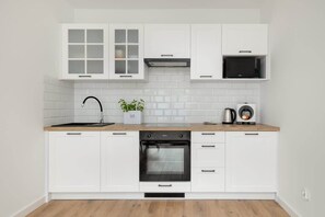 Kitchenette with an oven.