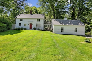 Colonial home set far back off the road so you never worry about the kids