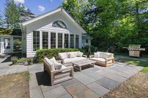 Bluestone patio was built spring of 2024.  Grass is already growing in