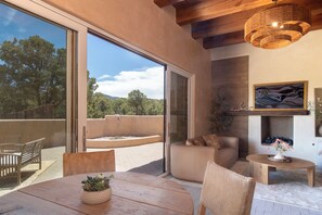 The great room opens onto a large patio with wood-burning fireplace.