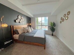 Premium hybrid technology mattress king size bed with a stunning pool and city view of Los Angeles 