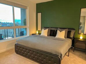 Comfortable King size bed with a stunning city skyline view of Los Angeles 