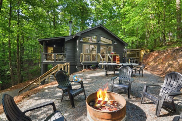Welcome to the backyard paradise with firepit, outdoor dining, with string light