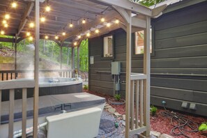 Enjoy the hot tub or cold plunge in the covered gazebo 