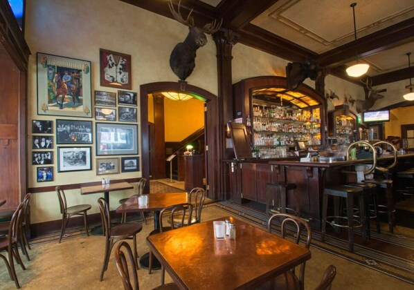 Enjoy a meal in the charming dining area of Jake's Grill, surrounded by classic decor and a warm ambiance. Ideal for a casual dining experience.