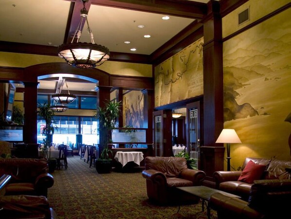 Relax in the cozy and welcoming lounge of Jake's Grill, offering a perfect spot for pre-dinner drinks or gatherings.