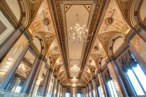 Host your next event in this stunning meeting room with ornate ceilings and abundant natural light. Perfect for conferences, seminars, and workshops.