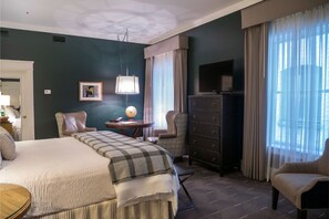 Enjoy a restful night in this stylish bedroom with plush bedding, modern decor, and a relaxing atmosphere.
