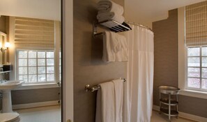 Enjoy a spacious shower in the well-appointed bathroom, designed with contemporary fixtures and ample lighting.
