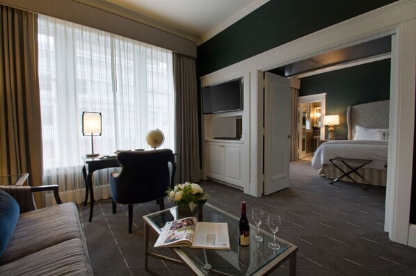 Enjoy the open-concept suite with a cozy living area and a separate bedroom, providing privacy and comfort for your stay.