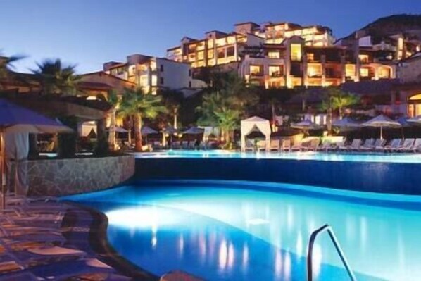 Pool at sunset with colorful reflections