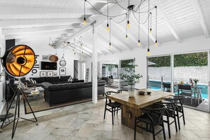 Great room with soaring vaulted wood beam ceilings