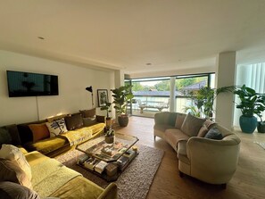 Lounge opens up onto a wrap around balcony with bi-folding doors 