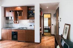 Kitchenette and hallway leading to bedroom
