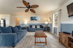 Gather around our rustic coastal living room for game nights and movie marathons.