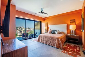 Beautiful master bedroom with a stunning view of the river and mountains