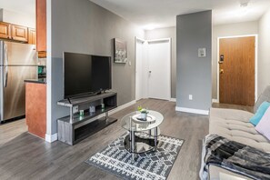 Modern Living Area With Smart TV And Sofa Bed
