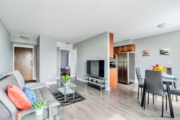 Open Living And Dining Area With Stylish Furniture And A Modern Kitchen
